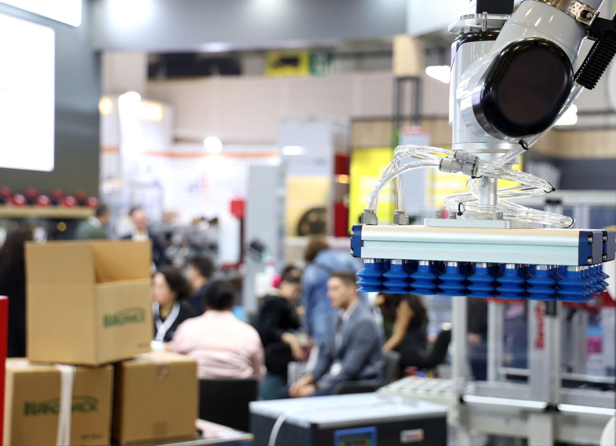 Global industry gathering set for Istanbul with Eurasia Packaging's 31st edition: a robotic vacuum gripper lifting cartons on an exhibitor stand at Eurasia Packaging Istanbul